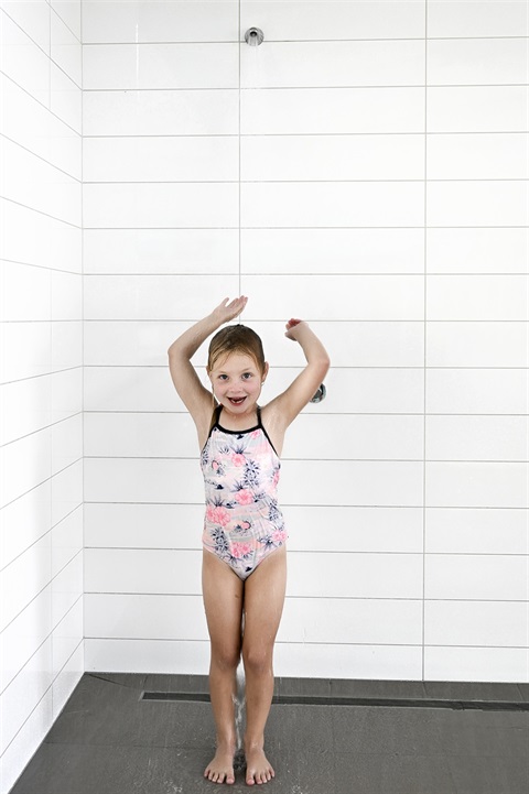 Indoor-Shower-female-child-smiling-portrait.jpg